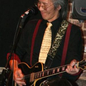 Geoff playing rock on his Les Paul guitar with the all-Asian band, The Emperor's Club, at Silk Road Cafe, Chinatown, NYC 2010
