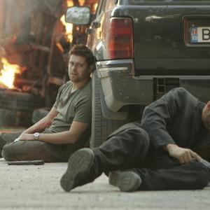 Tom Delmar Stunt Coordinator & 2nd Unit Director. Matthew Leitch (Dimitri) recovers from the blast in 'Razors Edge'.jpg