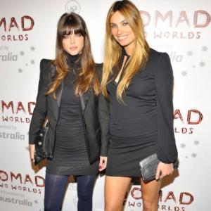 Models Nicole Lenz (L) and Alina Puscau arrive at the Donna Karan and Russel James' Nomad Two Worlds Opening Gala at Pier 59 Studios on February 22, 2011 in Santa Monica, California.