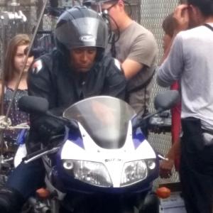 Stunt driver w Phantom rig on Kawasaki motorcycle.