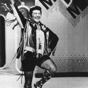 Lee Liberace on a television show in Philadelphia wearing hot pants as he performs for a studio audience