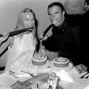 Burt Reynolds and Barbara Loden during a break in filming FadeIn hold an impromptu birthday party 1967 Paramount Pictures