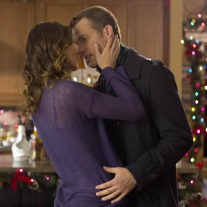 Still of Mark Lutz and Tricia Helfer in Finding Christmas (2013)