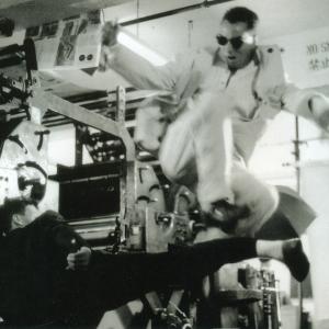 Vincent executing a flying sidekick over villain partner Jeff Falcon in the movie Blonde Fury