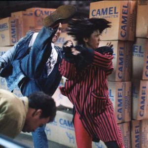 Vincent round house kicks Yukari Oshima as Ken Goodman ducks away in a scene from Outlaw Brothers One of my favorite shots!