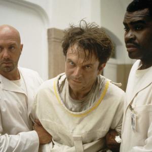 Still of Sam Neill, Gene Mack and Kevin Rushton in In the Mouth of Madness (1994)