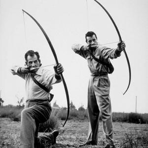 Guy Madison and his archery instructor, 1953.