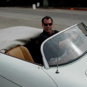 Mark Maine in Porsche on the set of The Month of August.