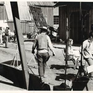 Shari Mann Sharon Evanoff on set with crew and cast in background during filming of one of her early films 1968