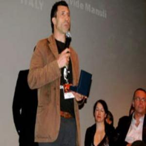Davide Manuli receiving the CUTTING THE EDGE AWARD at the MIAMI FILM FESTIVAL in 2009, for the movie BEKET.