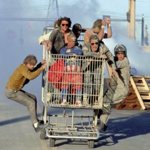 left Dave England right Ehren McGhehey in shopping cart beginning center clockwise Jason Wee Man Acuna Bam Margera Ryan Dunn SteveO Chris Pontius and Johnny Knoxville