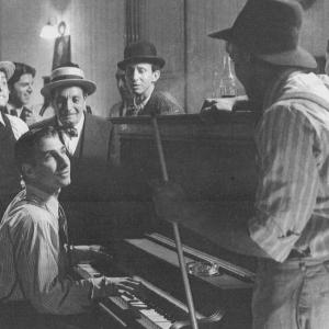 Irving Berlin Ethan Marten giving advice to Young Indiana Jones Scandal of 1920 Photo Courtesy of Lucasfilm Limited All rights reserved