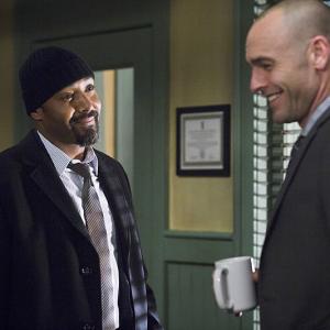 Still of Paul Blackthorne and Jesse L. Martin in The Flash (2014)