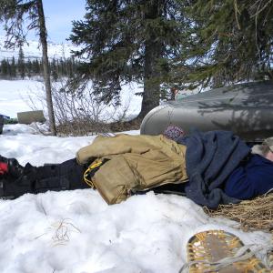 Taking a nap at the base of Mt. McKinley Alaska.