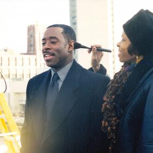 Cat'Ania McCoy-Howze, Makeup Department Head with Courtney B. Vance for Love and Action in Chicago. She removes the shine on the back of the head for an over-the-should camera shot