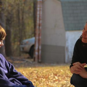 Director Emilie McDonald speaking to actor Tyler Williams during CROSSING THE RIVER shoot