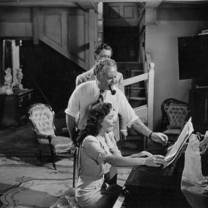 CATHERINE McLEOD rehearsing with director Frank Borzage on the set of Ive Always Loved You as leading man Philip Dorn looks on