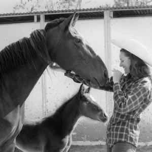 Lee Meriwether with a horse and pony c. 1975