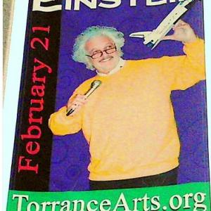 Advertisement on city street lamp-post for ED METZGER performing his nationally acclaimed EINSTEIN one-man theatrical show.