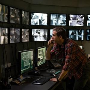 Ryan Reynolds has a telephone conversation with his Landlord Sean C Michael in Universals Safe House