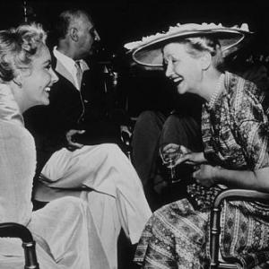 Elizabeth Taylor and columnist Hedda Hopper on the set of 