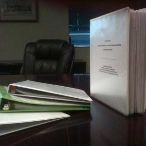 Four Part 240 Engineer certification files are shown The three on left are too thin and clearly will not pass FRA inspection The 25 thick book right contains 6 years worth of certification records It passed FRA review