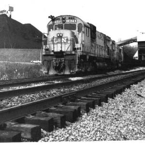1978. On the L&N Main at London, KY. Six-axle ALCO's take a pause in loading coal for the Engineer's camera.