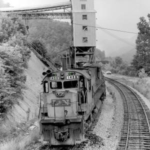 1977. Six-axle ALCO's reign supreme on the L&N's Corbin Division. However, there was always time for the Engineer to grab a classic photo. At KANEB Energy tipple on Straight Creek Extension, deep in the coalfields east of Pineville.
