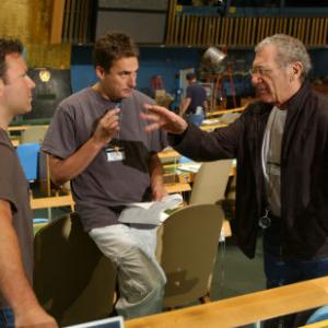 (L to r) Producer KEVIN MISHER, Producer TIM BEVAN and Director/Executive Producer SYDNEY POLLACK on the floor of the General Assembly during filming of The Interpreter, a suspenseful thriller of international intrigue set inside the political corridors of the United Nations and on the streets of New York.