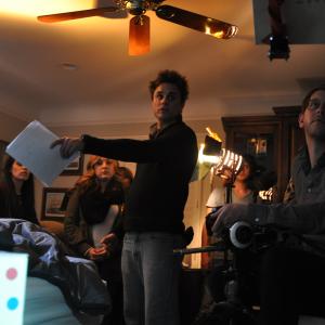 Producer Danielle Loo Production Designer Maddie McVey Director Bryce Mouer and Director of Photography Nate Lipp prepare to shoot a scene from GENRE