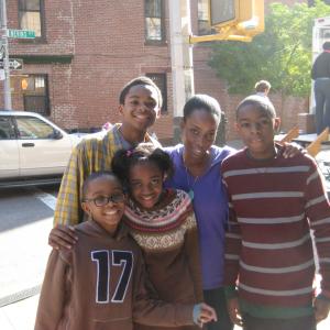 Shooting a KFC commercial posing with my faux broodthe sweet  talented Cummings siblings clockwise Michael Jr Me Collin Elina  Kaden It was so fun being their mum for a day! Dir Lisa RubischPark Pictures Bklyn NY Nov 2011