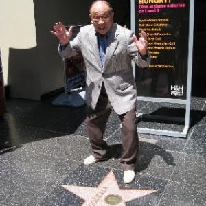Haruo Nakajima gave his famous Godzilla attack pose at Godzillas star on the Hollywood Walk of Fame during Monsterpalooza 2011