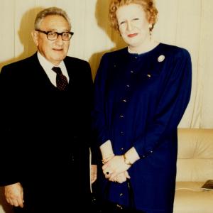 Steve Nallon in character as Margaret Thatcher with the real Henry Kissinger