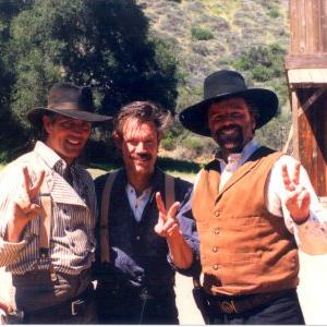 Eric Roberts Randy Travis and Steve Nave on the set of The Long Ride Home