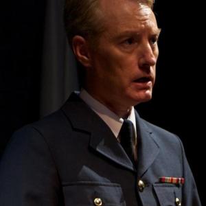 William Neenan as Nato Spokesman in Rod Dickinson's 'Closed Circuit'
