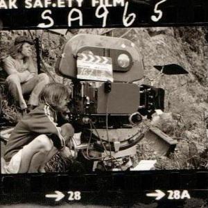 Sophie Neville as a child on a film set, looking down the lens of DoP Denis Lewiston's 35mm Panavision on location in the English Lake District in 1973