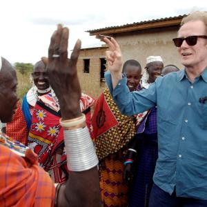 Bill Nighy, ambassador for Oxfam, visiting a Maasai community in Tanzania.