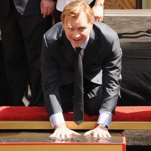 Director Christopher Nolan poses at the Christopher Nolan Handpirint Ceremony at Grauman's Chinese Theatre on July 7, 2012 in Hollywood, California.