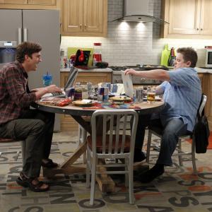 Still of Ashton Kutcher and Patton Oswalt in Two and a Half Men (2003)