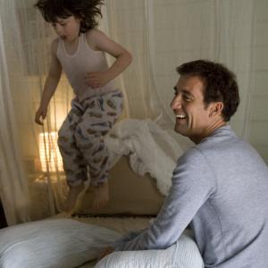 Still of Clive Owen and Nicholas McAnulty in The Boys Are Back 2009