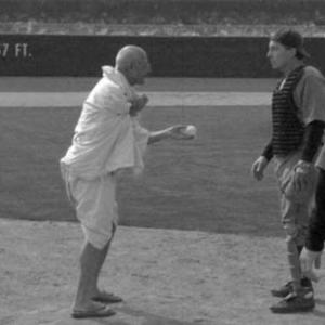 Mohandas K. 'Mo' Gandhi (Delfin Labao) meets Mickey 'Black Mike' Cochrane (Lee Perkins) in Yankee Stadium.