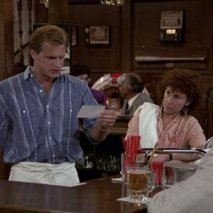 Still of Woody Harrelson and Rhea Perlman in Cheers 1982