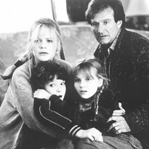 Still of Robin Williams, Kirsten Dunst, Bonnie Hunt and Bradley Pierce in Jumanji (1995)