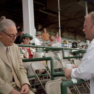 Actor Stacy Keach and writer/director Stu Pollard discuss a scene shooting at Louisville's legendary Churchill Downs racetrack.