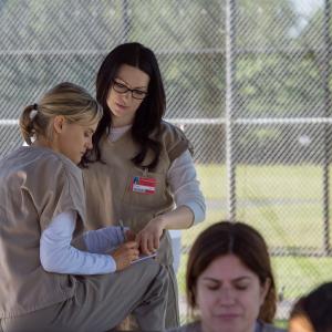 Still of Laura Prepon and Taylor Schilling in Orange Is the New Black 2013