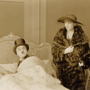 Still of Charles Chaplin and Edna Purviance in The Idle Class 1921