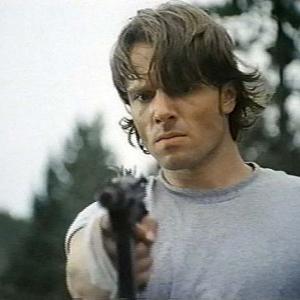 Max (John Pyper-Ferguson) levels the gun in the finale of David Winning's KILLER IMAGE (1992)