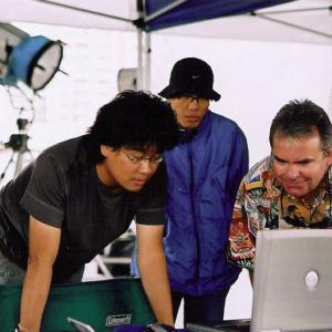 Director Bong Joon-Ho and Rafferty review CG shots on the set of The Host