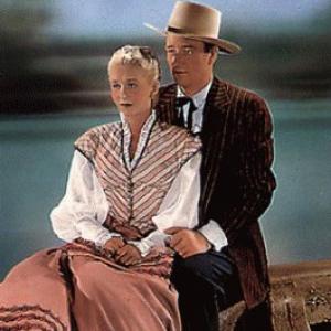 John Wayne and Vera Ralston in Dakota (1945)