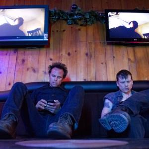 Walton Goggins and Kevin Rankin check their smart phones between scenes of the Debts and Accounts episode of JUSTIFIED